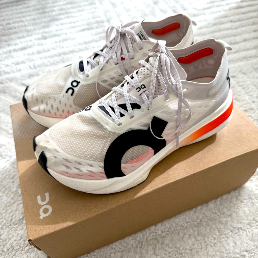 On Running White and Black Athletic Shoes